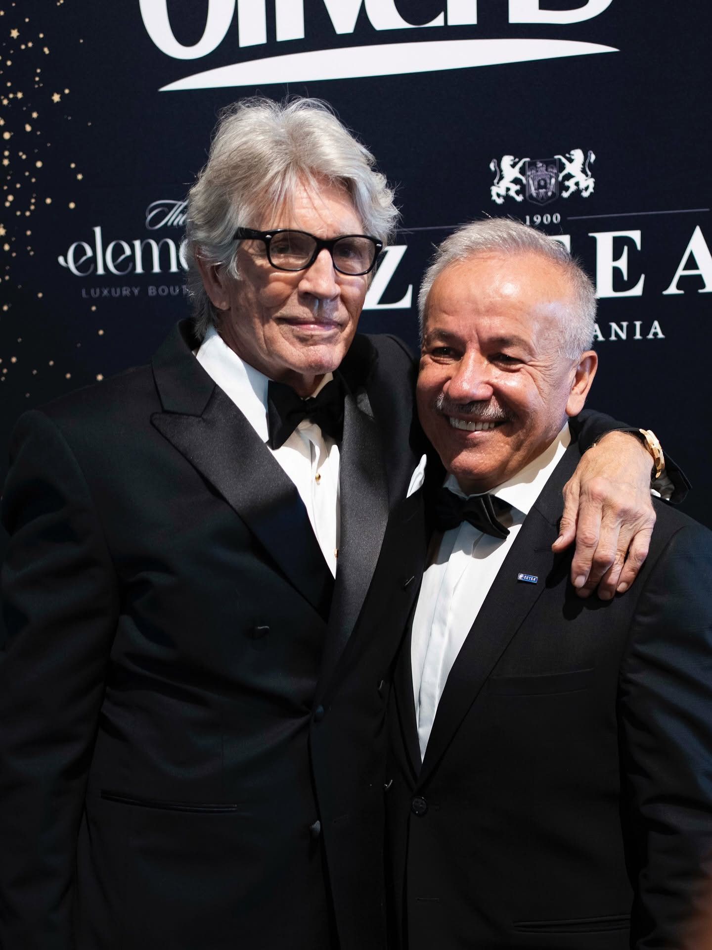 Eric Roberts and Silviu Zetea at the ZETEA event backdrop
